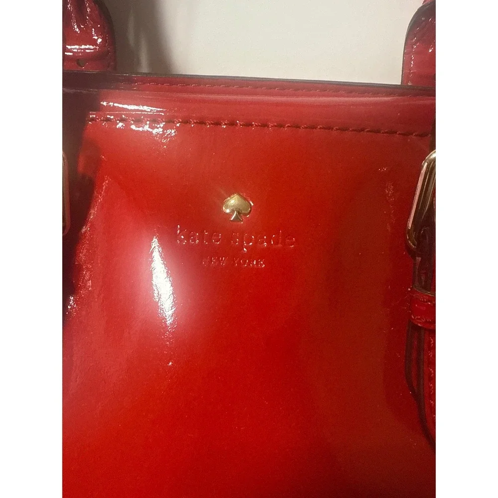 Kate Spade Carlisle Street Sylvie red patent leather satchel with shoulder strap